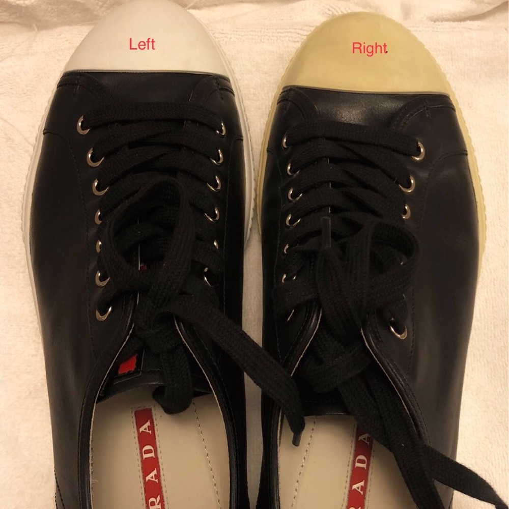 A pair leather Prada shoes